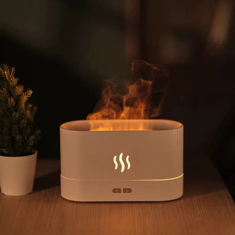 Diffuseur d’huiles essentielles Flamme LED en fonctionnement avec brume parfumée.