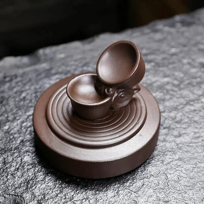 Effet cascade fumée apaisant avec théière en lévitation